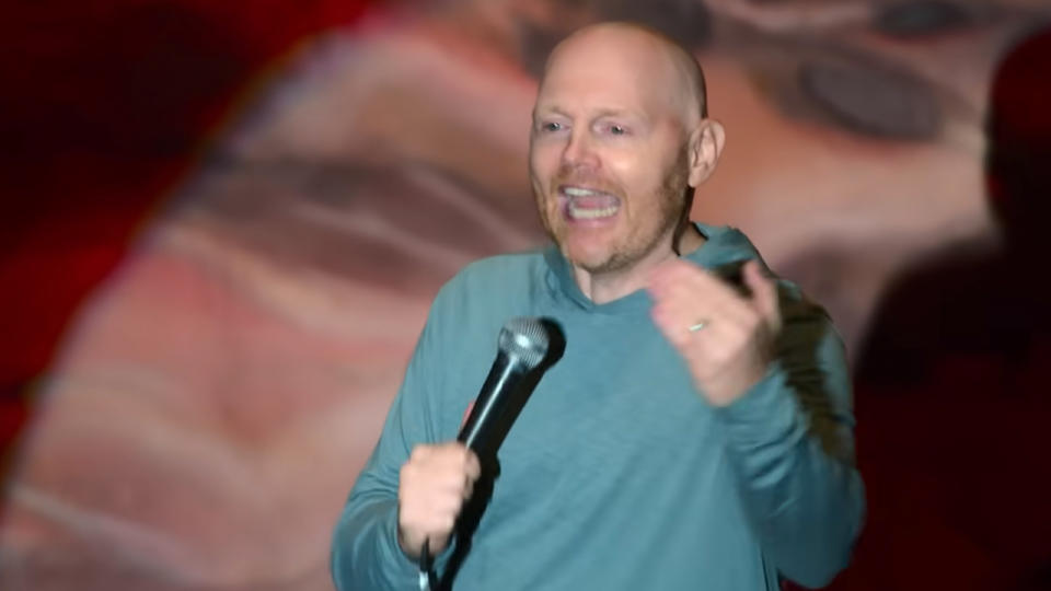 Bill Burr looking astounded in an aqua pullover