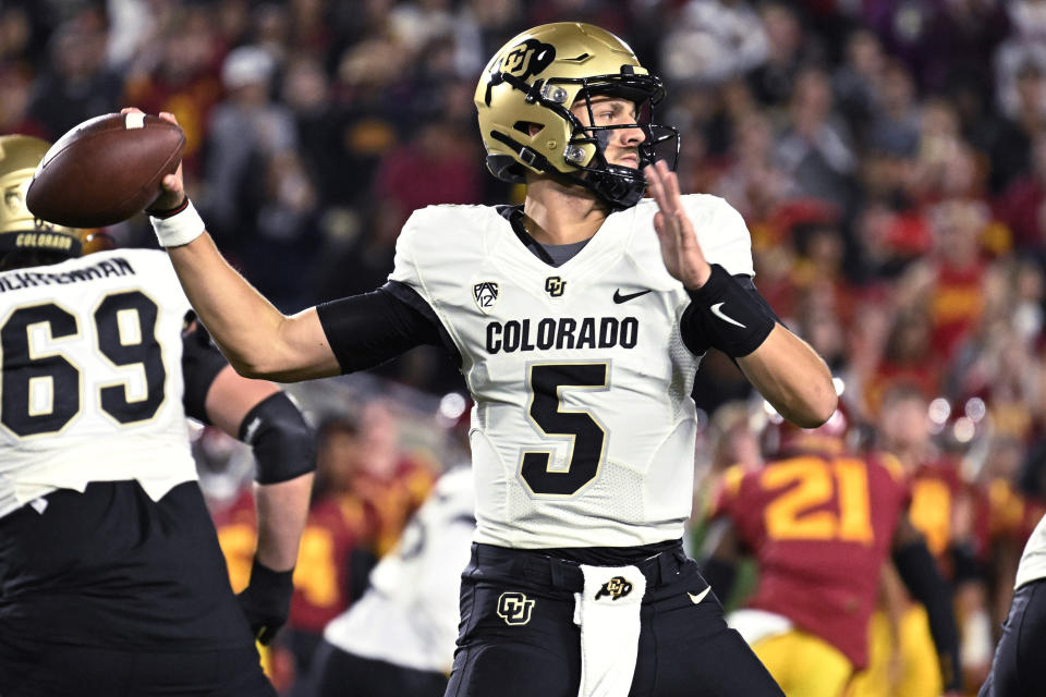 Colorado quarterback J.T. Shrout passes the ball against Southern California during the first half of an NCAA college football game Friday, Nov. 11, 2022, in Los Angeles. (AP Photo/John McCoy)