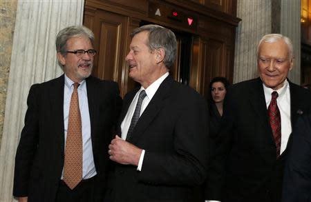 (L-R) Senators Tom Coburn (R-OK), Max Baucus (D-MT) and Orrin Hatch (R-UT) walk into the Senate chamber to vote on the U.S. budget bill in Washington December 18, 2013. REUTERS/Gary Cameron