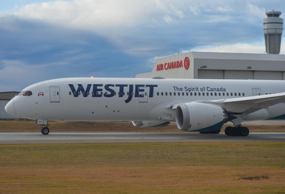 WestJet Airlines plane seen at YYC Calgary International Airport.
On Monday, October 25, 2021, in Calgary International Airport, Calgary, Alberta, Canada. (Photo by Artur Widak/NurPhoto via Getty Images)