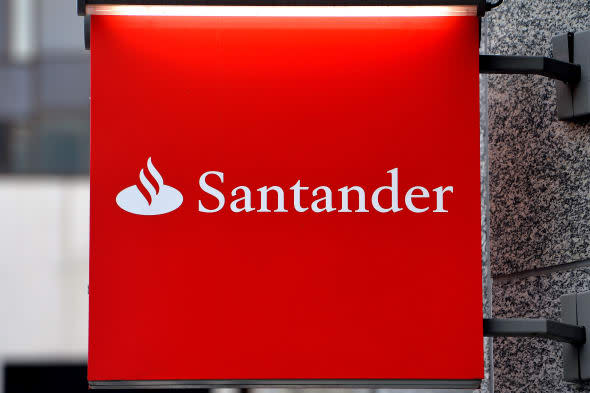 File photo dated 19/02/14 of a Santander bank sign in Victoria, central London as the high street lender has been fined ?12.4 million after the City watchdog uncovered 