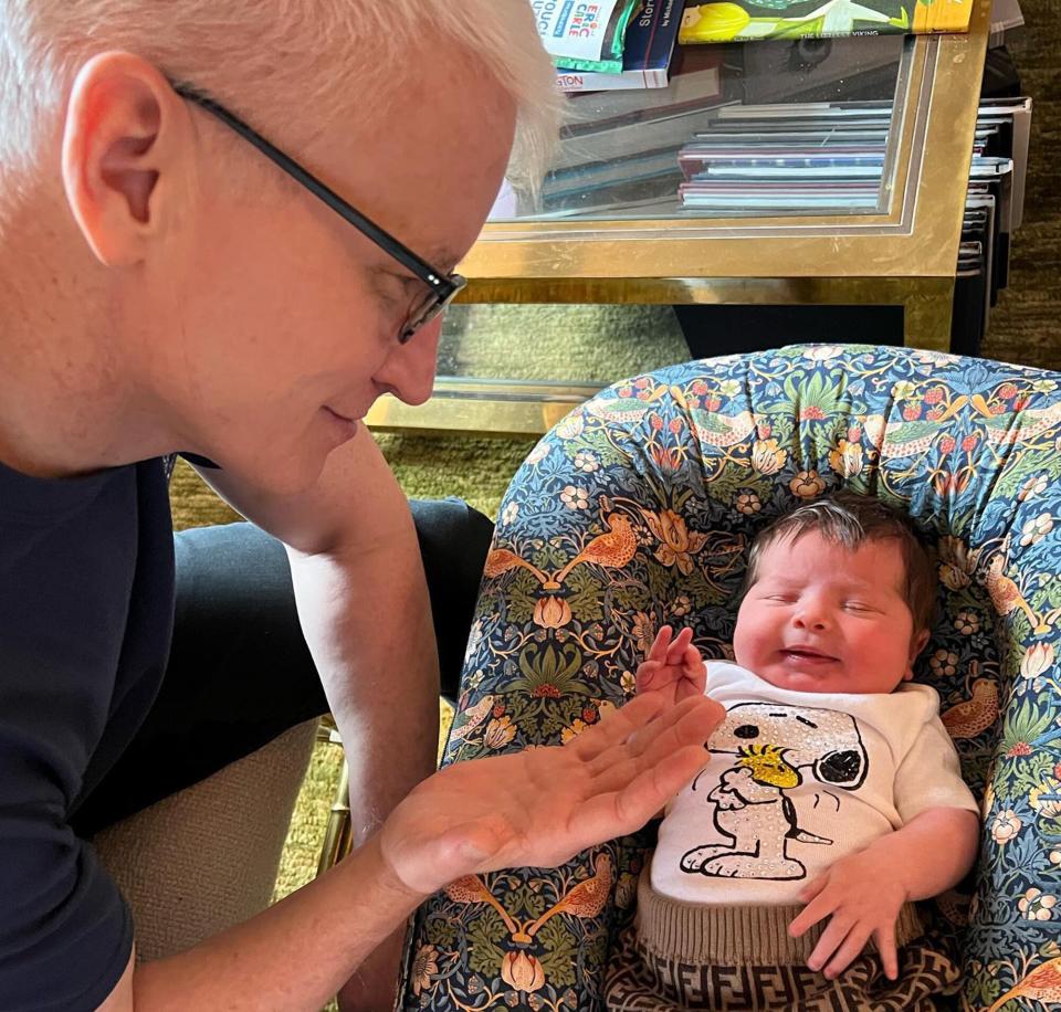 Anderson Cooper with Andy Cohen's newborn daughter