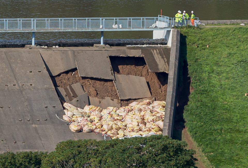 A picture shows bags of aggregate deployed by emergency services to reinforce a damaged section of the spillway of the Toddbrook Reservoir dam above the town of Whaley Bridge in northern England on August 2, 2019. - Emergency services continued work to repair a damaged dam they fear could collapse as hundreds of evacuated residents of the northern town of Whaley Bridge spent the night away from home. (Photo by Roland HARRISON / AFP)        (Photo credit should read ROLAND HARRISON/AFP/Getty Images)