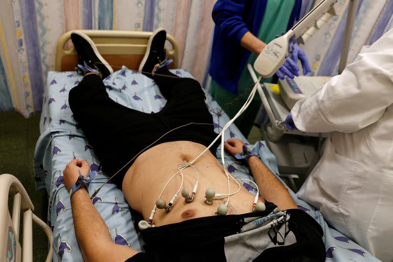 FILE PHOTO: A patient suffering from Long COVID is examined in the post-coronavirus disease (COVID-19) clinic of Ichilov Hospital in Tel Aviv