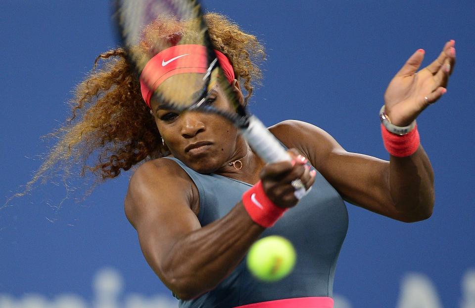 US tennis player Serena Williams returns a point to Italy's Francesca Schiavone during their 2013 US Open women's singles match at the USTA Billie Jean King National Tennis Center in New York on August 26 , 2013        (Photo credit should read EMMANUEL DUNAND/AFP/Getty Images)