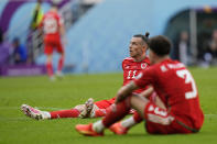 Wales' Gareth Bale, left, Neco Williams react after Iran's team scored the opening goal during the World Cup group B soccer match between Wales and Iran, at the Ahmad Bin Ali Stadium in Al Rayyan , Qatar, Friday, Nov. 25, 2022. (AP Photo/Pavel Golovkin)