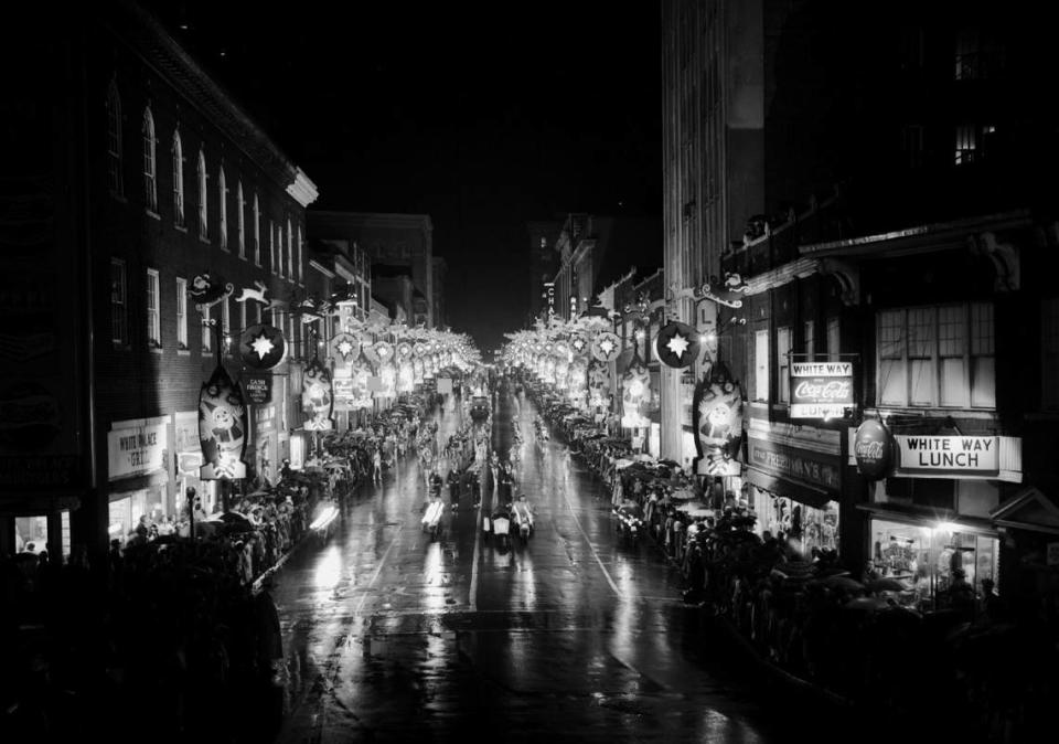 The Durham Christmas Parade makes its way down rain-slicked streets in the 1950’s.