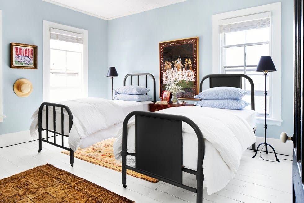 light blue bedroom with black furniture