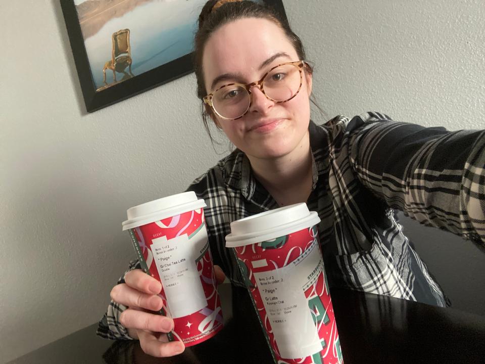 The writer holds both Starbucks beverages