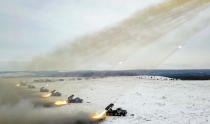 FILE - In this image taken from video and released by Russian Defense Ministry Press Service, Russian rocket launchers fire during military drills near Orenburg in the Urals, Russia, Dec. 16, 2021. Amid a buildup of Russian troops near Ukraine, Moscow has denied planning an attack on Ukraine but urged the U.S. and its allies to provide a binding pledge that NATO won't expand to Ukraine and won't deploy military assets there _ a demand rejected by the West. (Russian Defense Ministry Press Service via AP, File)