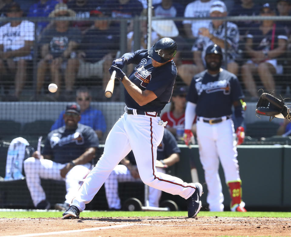 Atlanta Braves first baseman Matt Olson hits an RBI single against the Minnesota Twins in this third inning of a spring training baseball game Friday, March 18, 2022, in North Port, Fla. (Curtis Compton/Atlanta Journal-Constitution via AP)