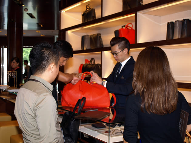 An LV sales representative attends to a customer. (Yahoo! photo)