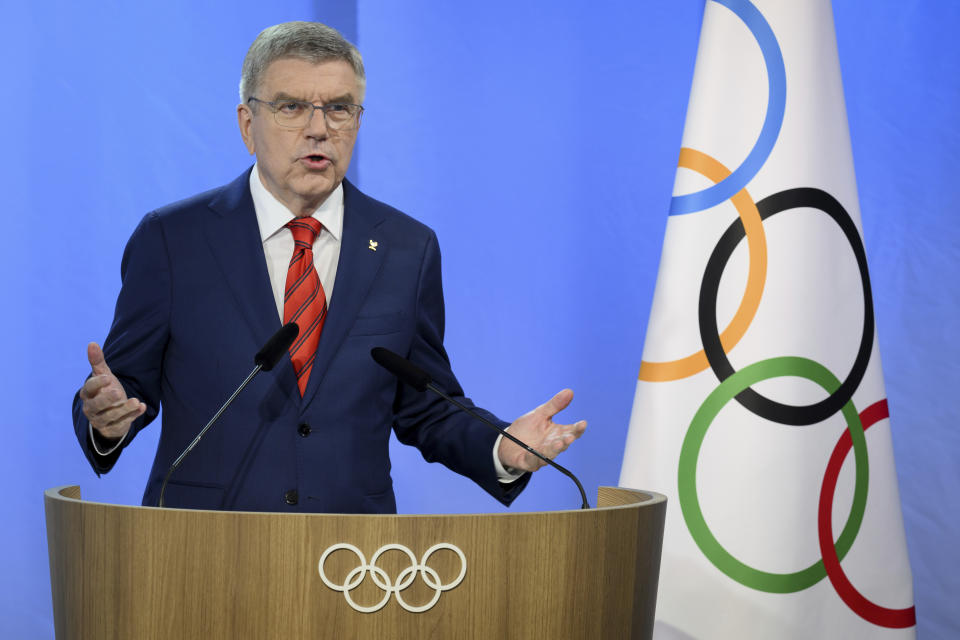 FILE - International Olympic Committee (IOC) President Thomas Bach speaks at the opening of the extraordinary hybrid 140th IOC Session of the International Olympic Committee (IOC), at the Olympic House, in Lausanne, Switzerland, Thursday, June 22, 2023. A year out from the Paris Olympics, and nearly a year and a half since Russia's full-scale invasion of Ukraine, officials governing the many sports on the Olympic program are still split on how to treat Russian athletes. (Laurent Gillieron/Keystone via AP, File)