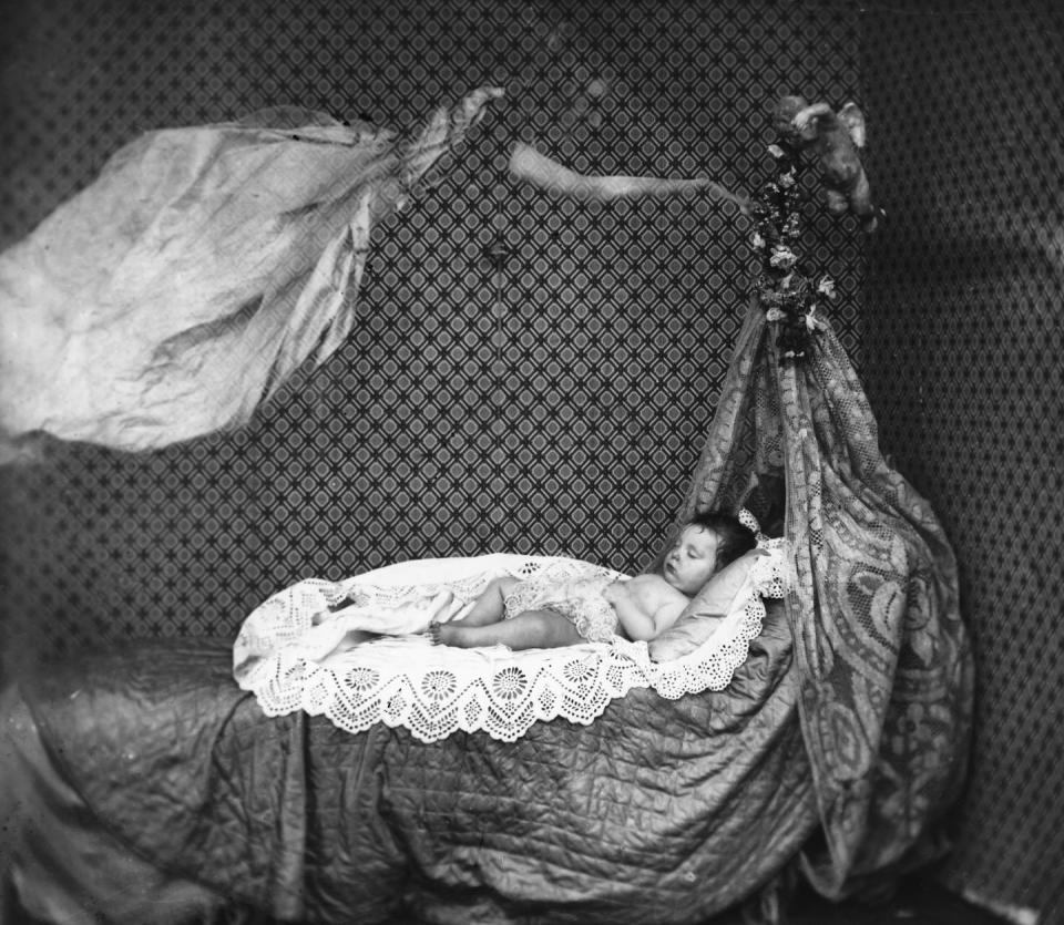 A "Ghost" Floats Above a Sleeping Baby (c. 1860)