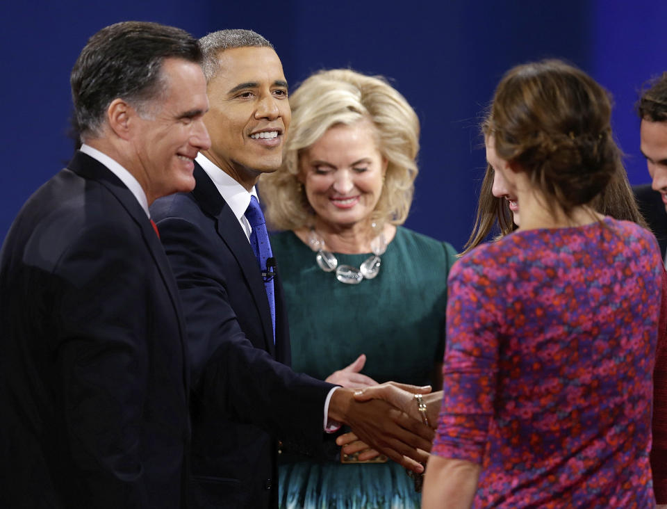 President Barack Obama greets members of Republican presidential nominee Mitt Romney's family after the third presidential debate at Lynn University, Monday, Oct. 22, 2012, in Boca Raton, Fla. (AP Photo/Charlie Neibergall)