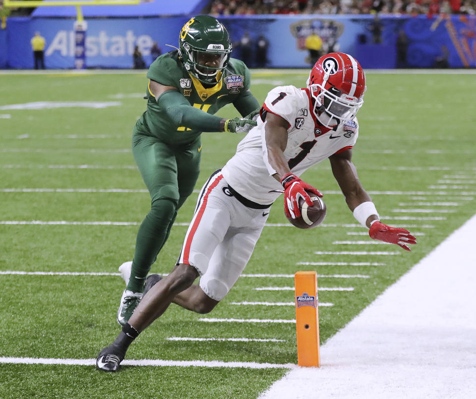 Georgia wide receiver George Pickens scores a touchdown past Baylor cornerback Jameson Houston during the first half of the Sugar Bowl NCAA college football game Wednesday, Jan. 1, 2020, in New Orleans. (Curtis Compton/Atlanta Journal-Constitution via AP)