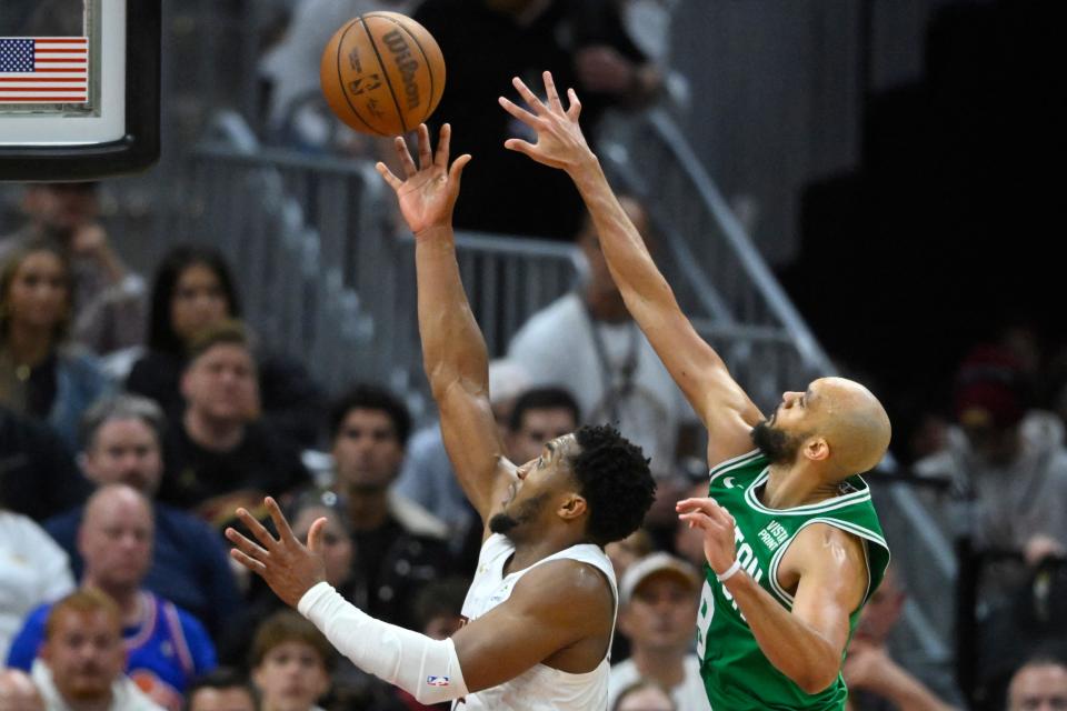Cavaliers guard Donovan Mitchell shoots as Celtics guard Derrick White defends in the fourth quarter of Game 3 of the Eastern Conference semifinals, May 11, 2024, in Cleveland.
