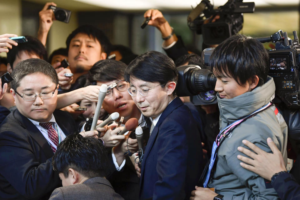 South Korean Foreign Ministry's Director-General for Asian and Pacific Affairs, Kim Jung-han, center, is mobbed by reporters as he leaves Foreign Ministry after meeting with Japanese officials in Tokyo Friday, Nov. 15, 2019. Japanese and South Korean diplomats met to discuss broad issues, including a plan by Seoul to scrap the General Security of Military Information Agreement, or GSOMIA, an intelligence-sharing arrangement that symbolized three-way security cooperation with Washington over the North Korean nuclear threat and China's growing regional influence. It is due to expire in late November. (Ren Onuma/Kyodo News via AP)