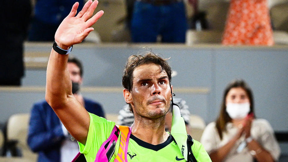 Seen here, Rafael Nadal waves to the crowd after being knocked out of the French Open.