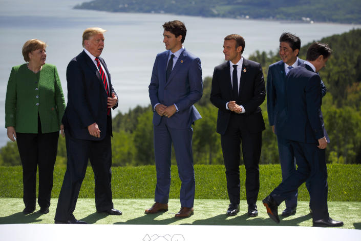 (Left to right) Germany's Angela Merkel, the United States' Donald Trump, Canada's Justin Trudeau, France's Emmanuel Macron, Japan's Shinzo Abe and Italy's Giuseppe Conte get in place for a photo during the G-7 summit in Canada on Friday. (Photo: Bloomberg via Getty Images)