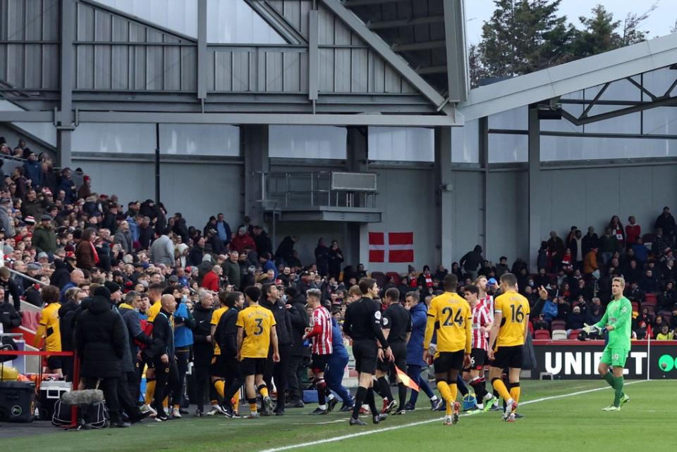 Brentford and Wolves players leave the field (Reuters)