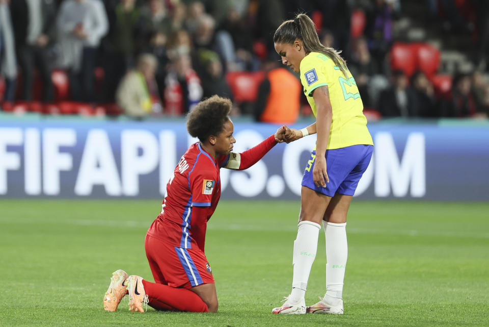 Brazil's Gabi Nunes,right, grabs the hand of Panama's Yomira Pinzon following the Women's World Cup Group F soccer match between Brazil and Panama in Adelaide, Australia, Monday, July 24, 2023. (AP Photo/James Elsby)