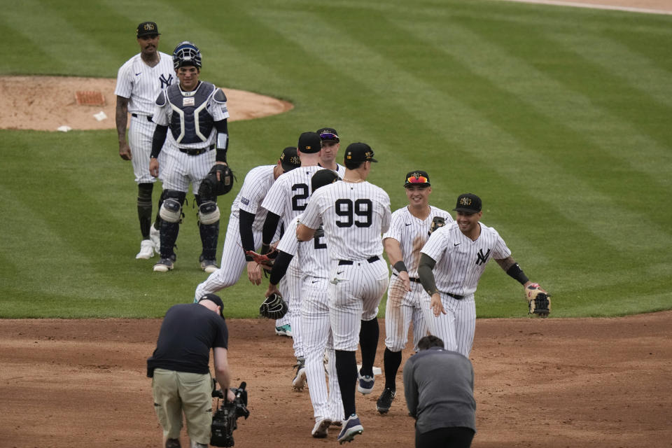 New York Yankees' Aaron Judge (99) celebrates with teammates after a baseball game against the Chicago White Sox, Saturday, May 18, 2024, in New York. The Yankees won 6-1. (AP Photo/Frank Franklin II)