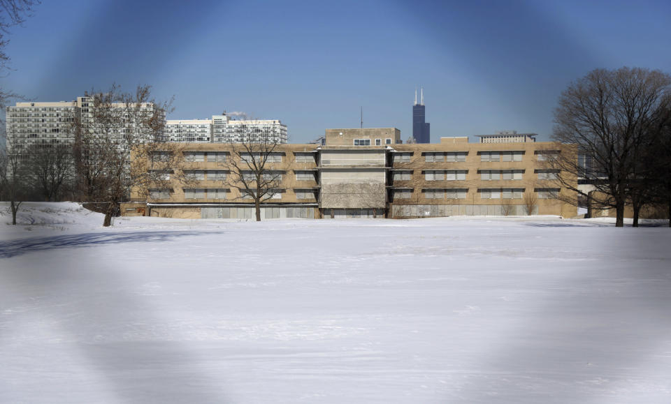 In this Friday, Feb. 7, 2014 photo, shows a view shot through a fence looking north of the area that once housed the former Michael Reese Hospital in the south side neighborhood of Bronzeville. The site in Bronzeville, the city’s historic center of black culture, business and politics, is one of six potential Chicago sites bidding to be the location for a Barack Obama presidential library, each backed by different interests. (AP Photo/M. Spencer Green)