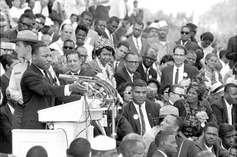 Martin Luther King Jr., head of the Southern Christian Leadership Conference, addresses thousands of civil rights supporters gathered in front of the Lincoln Memorial for the March on Washington on Aug. 28, 1963.  Actor-singer Sammy Davis Jr., lower right, was there for King's "I have a dream" speech.