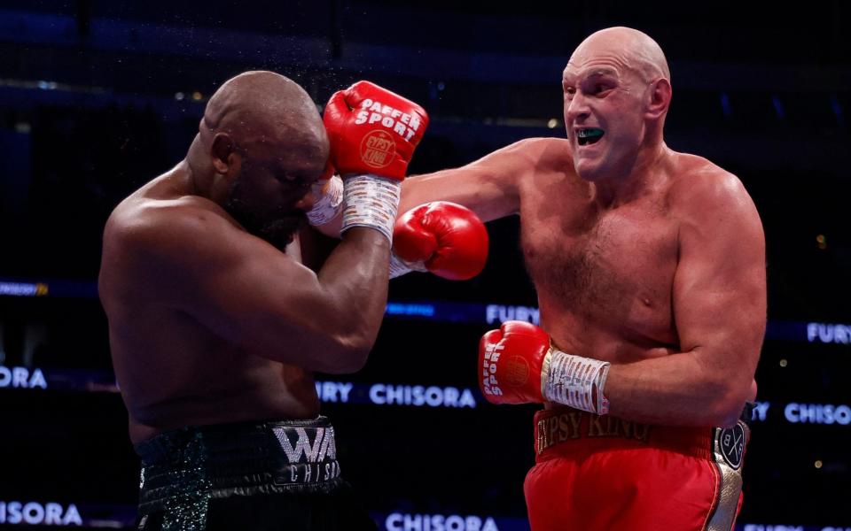 Boxing - WBC World Heavyweight Title - Tyson Fury v Derek Chisora - Tottenham Hotspur Stadium, London, Britain - December 3, 2022 Tyson Fury in action during his fight against Derek Chisora - Reuters/Andrew Couldridge