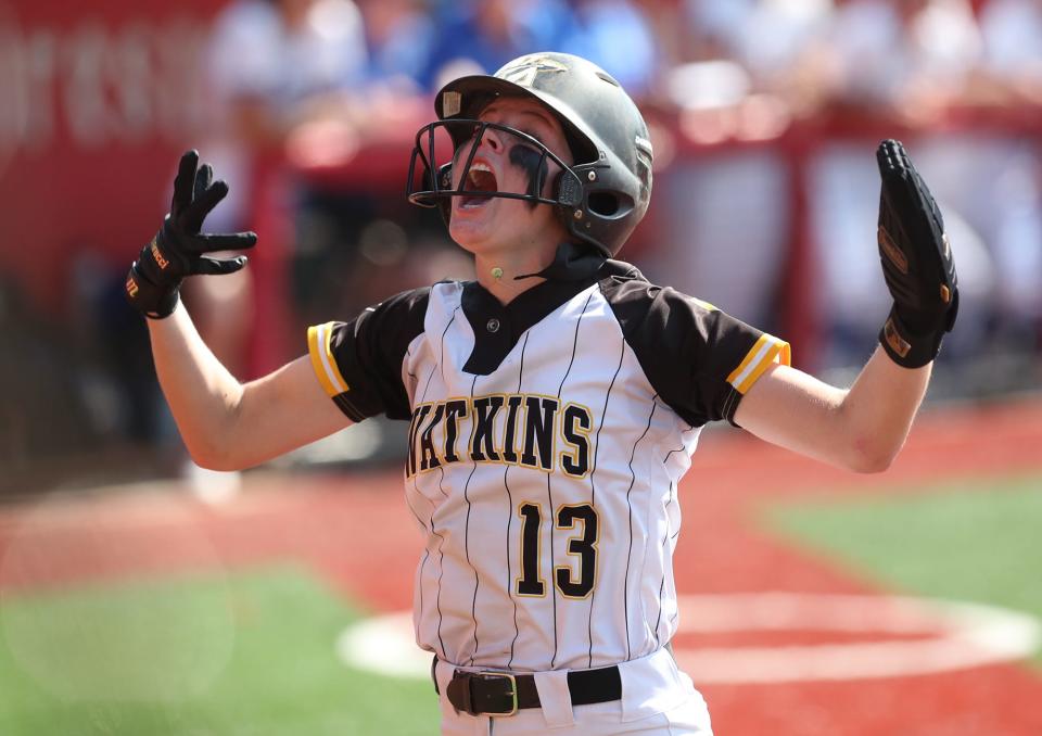 Watkins Memorial's Jordyn Wycuff celebrates scoring in the first inning against Anthony Wayne in the Div. I state semifinal softball at Firestone Stadium in Akron.