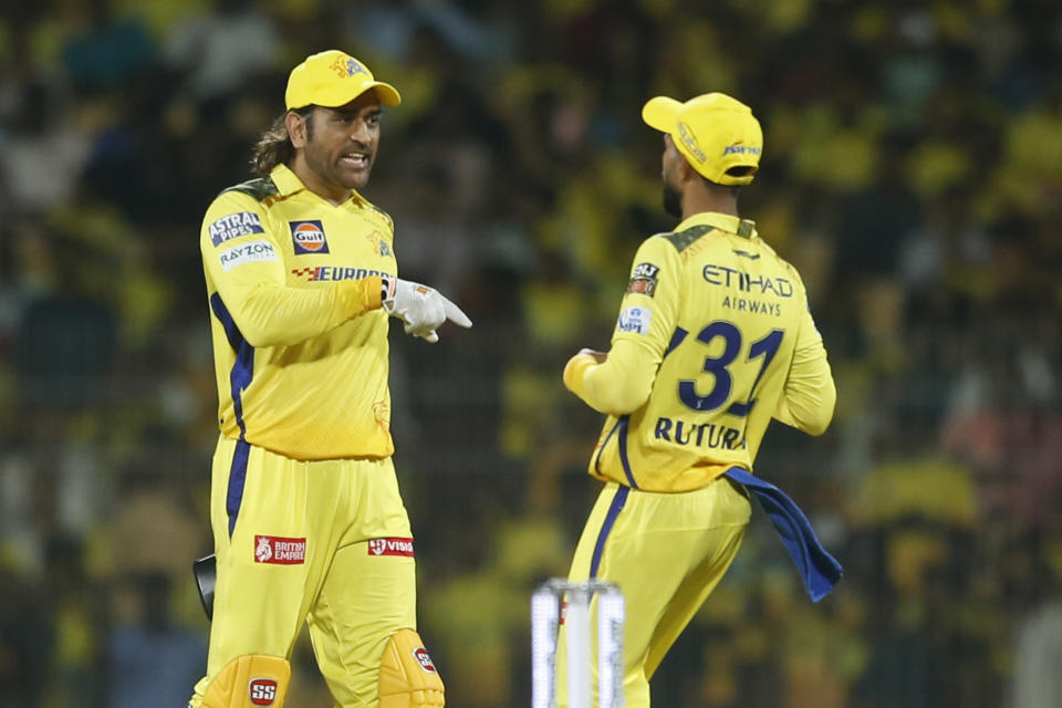 Chennai Super Kings' MS Dhoni talk to Captain Ruturaj Gaikwad during the Indian Premier League cricket tournament between between Chennai Super Kings and Gujarat Titans, in Chennai, India, Tuesday, March 26, 2024. (AP Photo/R. Parthibhan)