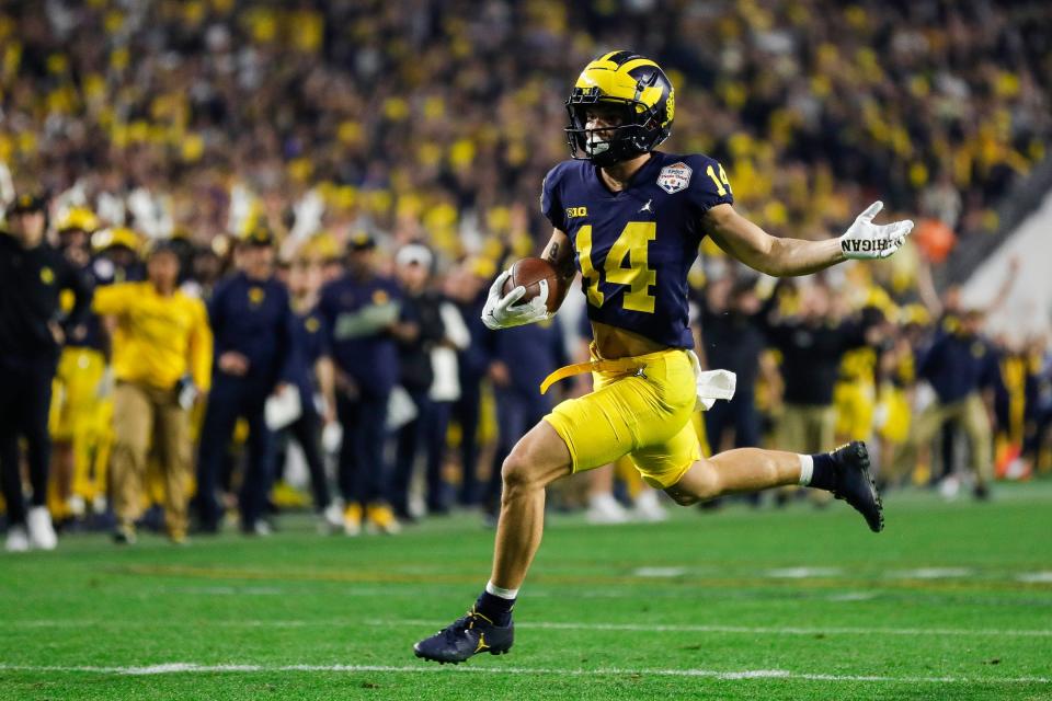 Michigan wide receiver Roman Wilson (14) runs against TCU during the second half at the Fiesta Bowl at State Farm Stadium in Glendale, Ariz. on Saturday, Dec. 31, 2022.