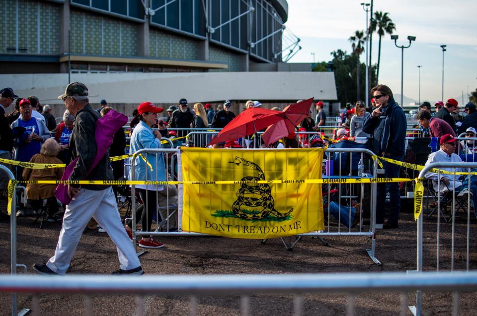 A Gadsden flag hangs in line on Feb. 19, 2020, the morning of a rally held by President Trump at the Veterans Memorial Coliseum on the Arizona State Fairgrounds in Phoenix.