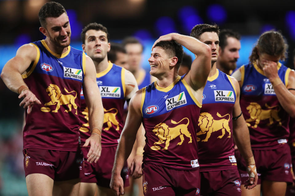 Brisbane Lions players, pictured here celebrating after their win over Sydney at the SCG.