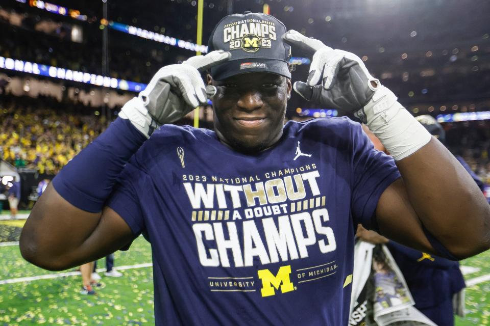 A Michigan football player celebrates the 34-13 win over Washington to win the national championship game at NRG Stadium in Houston on Monday, Jan. 8, 2024.