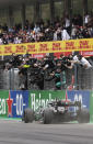 Mercedes driver Lewis Hamilton of Britain crosses the finish line to win the Formula One Portuguese Grand Prix at the Algarve International Circuit in Portimao, Portugal, Sunday, Oct. 25, 2020. (Jose Sena Goulao, Pool via AP)