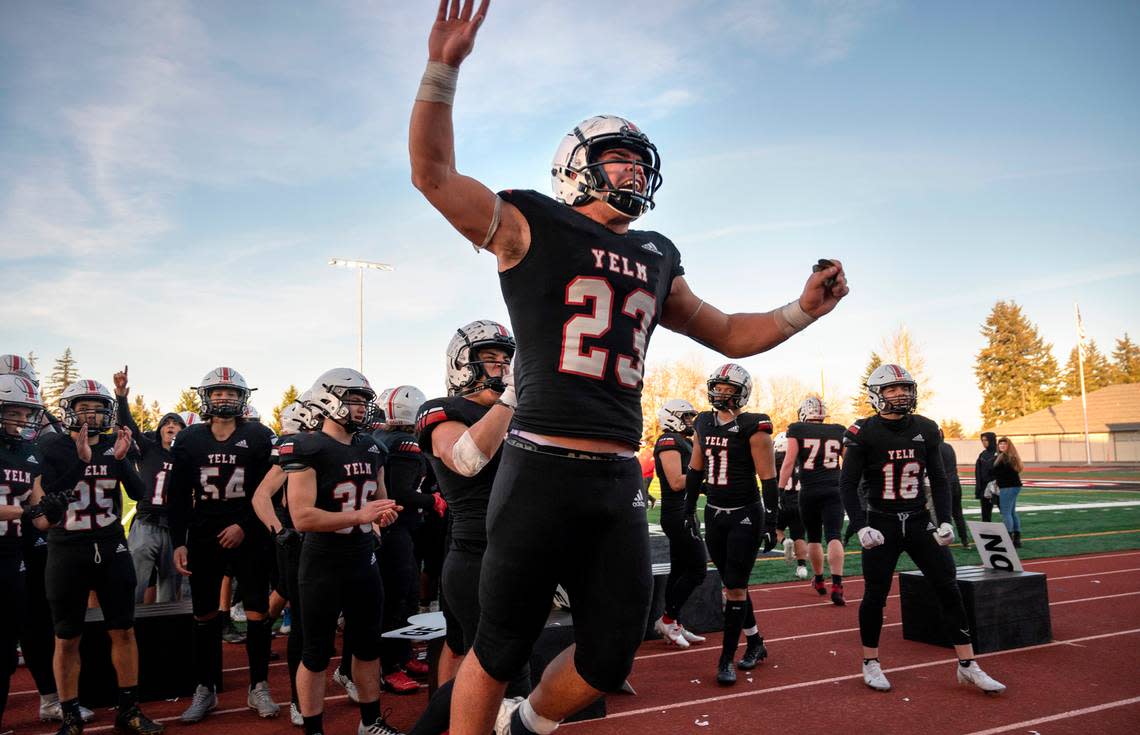 Yelm junior running back Brayden Platt celebrates with teammates following the Tornados’ 36-27 victory over the Kennewick Lions in Saturday afternoon’s 3A football state quarterfinal game at Yelm High School in Yelm, Washington, Nov. 19, 2022.