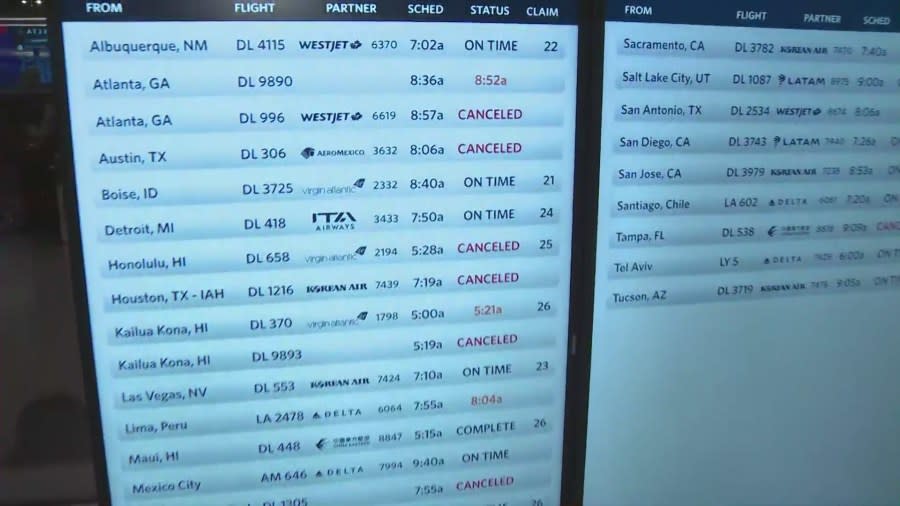 A board in the Delta terminal at LAX shows several delays and cancellations due to lingering effects from the global IT outage on July 23, 2024.