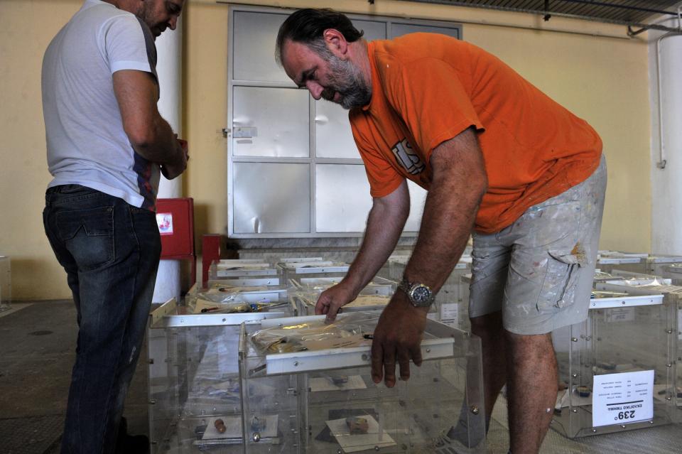 Electoral workers prepare ballot boxes in a warehouse in Thessaloniki, Greece, on July 2, 2015, ahead of the upcoming referendum.