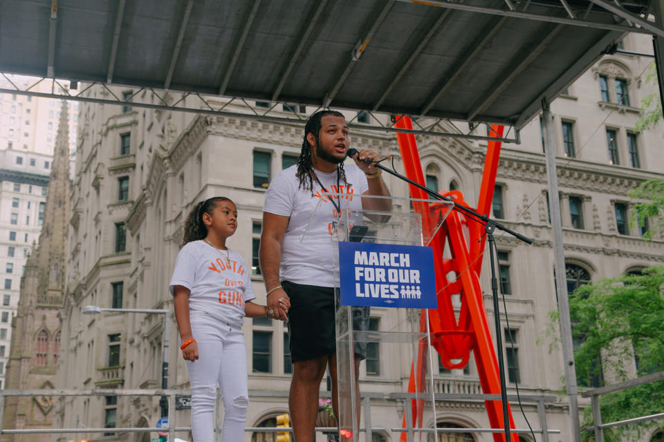 <em>Luis Hernandez addresses marchers in lower Manhattan with his 9-year-old sister. “I’m 9 — please don’t shoot when I’m learning,” she said at the end of his speech.</em>