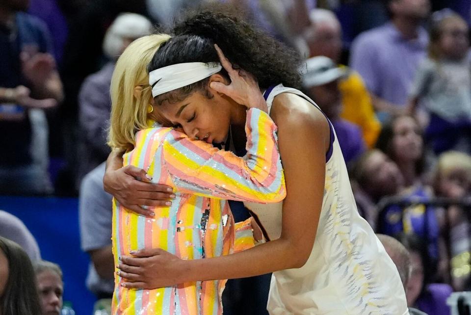 LSU head coach Kim Mulkey hugs forward Angel Reese late in the second half of a second-round college basketball game against Middle Tennessee in the women's NCAA Tournament in Baton Rouge, La., Sunday, March 24, 2024. LSU won 83-56. (AP Photo/Gerald Herbert)