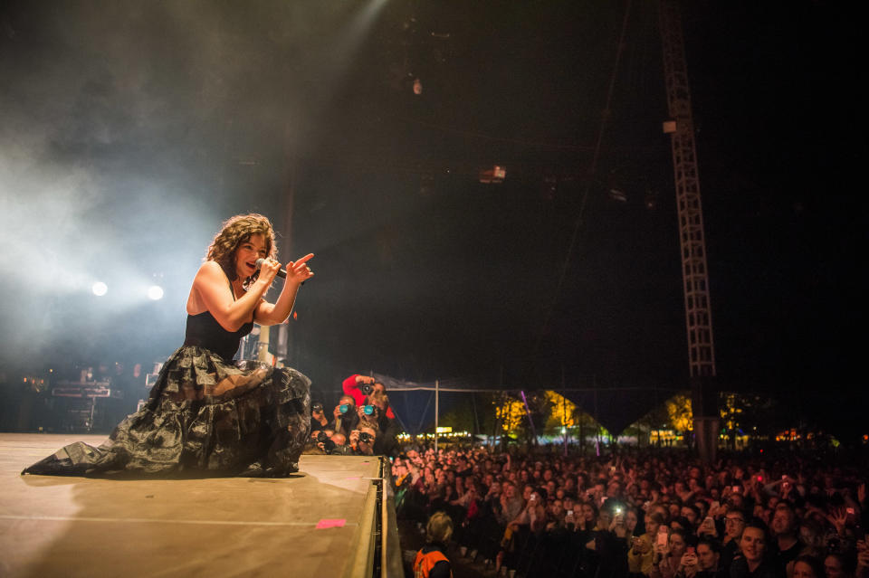 Lorde performs to a crowd below her