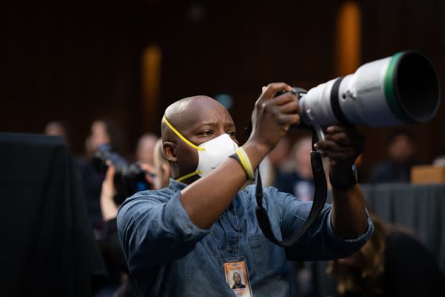 Michael McCoy photographs Ketanji Brown Jackson's confirmation hearing. (Photo: Sarahbeth Maney/The New York Times)