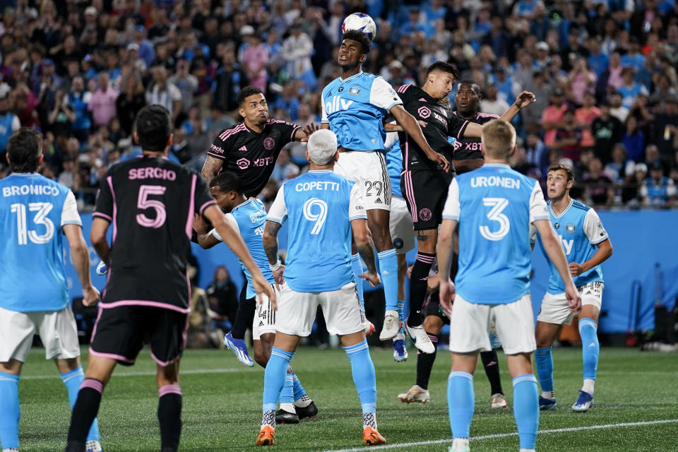 Charlotte FC defender Adilson Malanda (29) heads the ball during the second half of an MLS soccer match against Charlotte FC, Saturday, Oct. 21, 2023, in Charlotte, N.C. (AP Photo/Erik Verduzco)