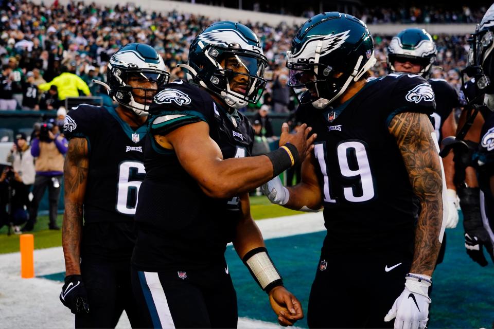 Philadelphia Eagles' Jalen Hurts (1) celebrates with J.J. Arcega-Whiteside (19) after scoring a touchdown during the second half of an NFL football game against the New Orleans Saints, Sunday, Nov. 21, 2021, in Philadelphia. (AP Photo/Derik Hamilton)