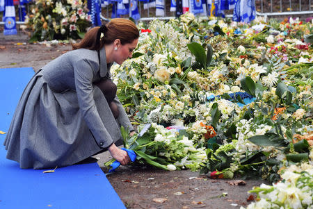 Britain's Catherine, The Duchess of Cambridge, adds a bouquet view tributes to Leicester City's owner Thai businessman Vichai Srivaddhanaprabha, outside Leicester City's King Power stadium in Leicester, Britain, November 28, 2018. Arthur Edwards/Pool via REUTERS