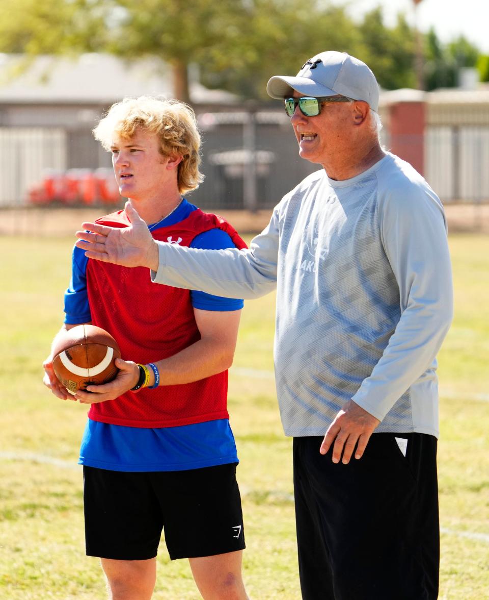 Chandler High football head coach Rick Garretson and quarterback Blake Heffron during spring football practice in Chandler on May 8, 2023.