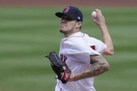 Boston Red Sox's Tanner Houck winds up for a pitch against the New York Yankees in the first inning of a baseball game, Sunday, Sept. 20, 2020, in Boston. (AP Photo/Steven Senne)