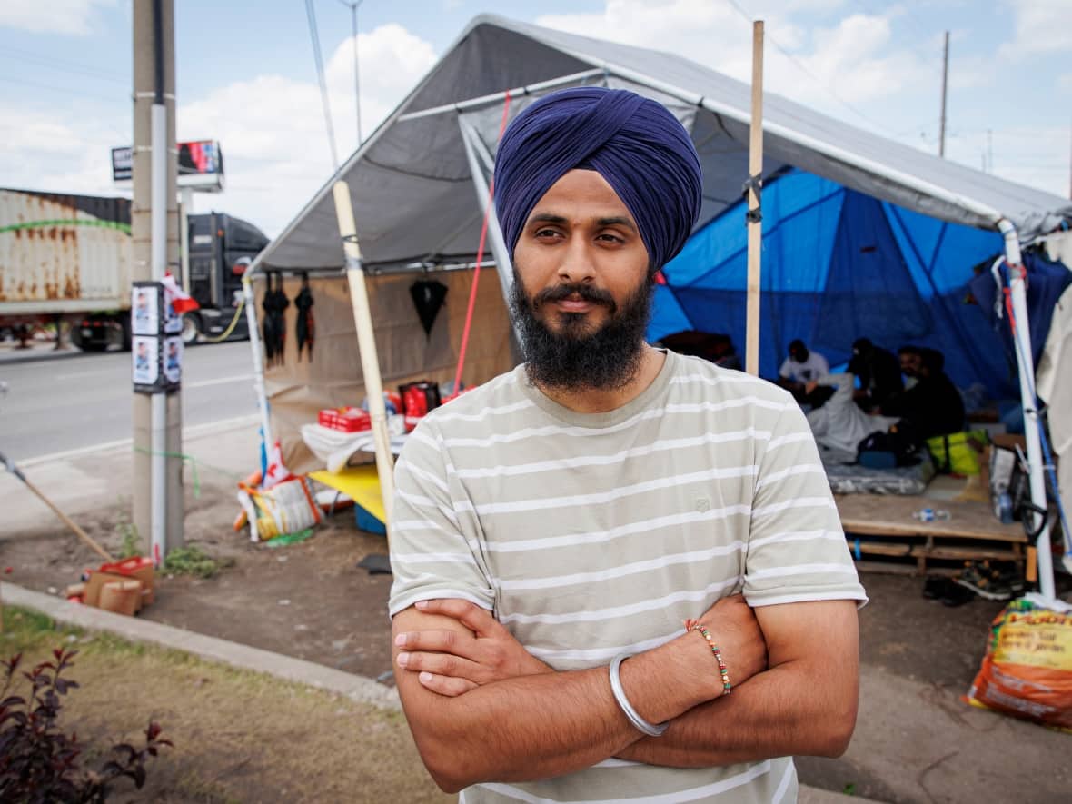Lovepreet Singh is seen at a sit-in protest site in Mississauga on June 13, 2023 — the day he was scheduled to be deported. (Evan Mitsui/CBC - image credit)